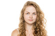 © vladimirfloyd - Young woman with curly blonde hair, freckles and natural makeup, looking at camera. Close-up portrait on white background