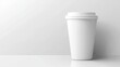 © tinnakorn - Clean white coffee cup on pristine white surface, a minimalist still life photography