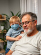 © Julian - Father and son in coronavirus disease concept at home