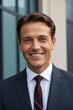 © haiqiang - smiling man in suit and tie outside of a building