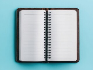 Wall Mural - Open notebook with blank white pages, isolated on a solid background
