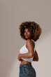 © face_reader_img - Beautiful African American woman with curly hairstyle looking away. Vertical image.