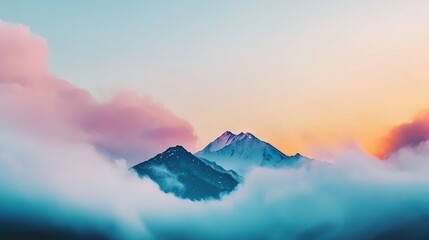 Wall Mural - a mountain shrouded in cloud with pink and blue sky in backdrop and foreground