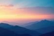 © Sourithideth - Layered blue mountains meet the horizon at dawn under a warm and inviting gradient sky, gentle light, warm, clouds