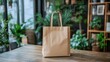 © Almahyra - Brown paper bag with pine branches on wooden table.
