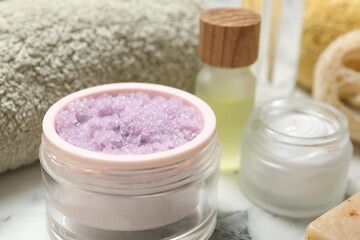 Wall Mural - different body care products on white marble table, closeup
