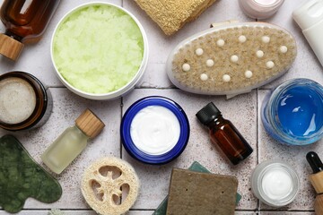 Wall Mural - different body care products on light tiled table, flat lay