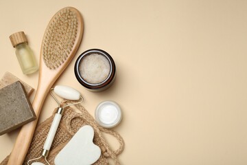 Wall Mural - different body care products on beige background, flat lay. space for text