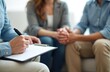 © Vadym - Close-up of couple at relationship therapy session with counselor taking notes. Psychologist listens to marriage problems, offers solutions, support. Couple discusses emotional health, mental issues,