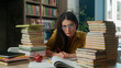 © Yuliia - Caucasian woman sad girl high school student teacher writing lesson learning frustrated tired pupil nerd studying university college library books overwork education stress problem overload ask help