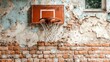 © VirtuLens - Old basketball hoop on a weathered brick wall telling stories of play