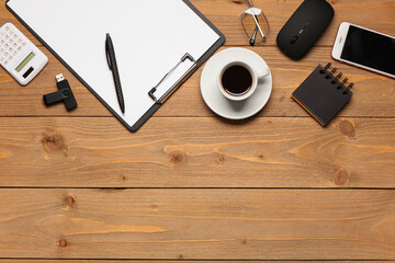 Wall Mural - clipboard, cup of coffee and computer mouse on wooden background