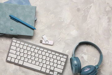 Wall Mural - computer keyboard, notebook and headphones on grunge background