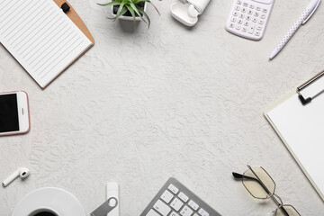 Wall Mural - frame made of clipboard, computer keyboard, stationery and glasses on white background