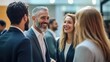 © jovi adnan - Businesspeople Networking and Smiling at a Conference