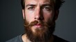 © ArtPro - A person with a hipster beard is shown against a dark background.