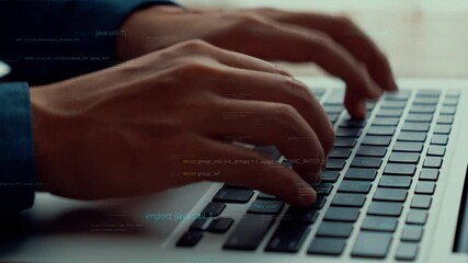 Computer programmer uses capable laptop computer to develop programming code of new software . Computer specialist working on future coding application for software programming development .