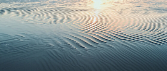 Poster - Gentle ripples on sand with soft breeze at sunset create serene atmosphere