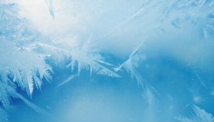 Poster - delicate frost patterns on frozen glass with an icy blue background, creating a natural winter texture for seasonal designs and wallpaper