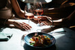© FornStudio - Glasses of rose wine seen during a friendly party or a celebration in a restaurant of a bar.