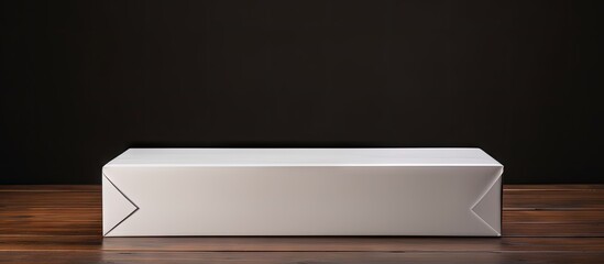 Poster - Minimalist empty white gift box on dark wooden table against a black background with ample copy space for holiday or gift content.