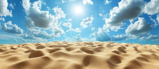 Fototapete - Golden sand dunes under a bright blue sky filled with fluffy white clouds and a radiant sun casting warm light from above.