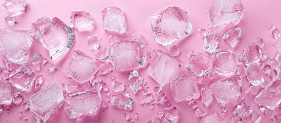 Leinwandbilder - Top view of clear crushed ice scattered across a soft pink backdrop with ample negative space for text on the right side of the image
