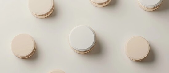 Aufkleber - Modern beauty product packaging featuring a central white container with a beige cap surrounded by beige circular elements on a light background