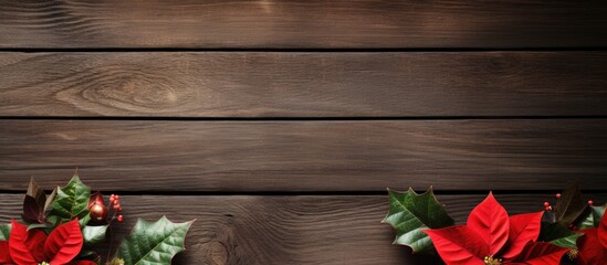 Poster - Wooden table surface featuring red poinsettias and green holly garlands framing the scene with gift boxes on the left providing ample copy space.