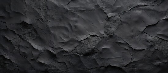 Leinwandbilder - Textured black plaster surface with peeling layers and intricate details showcasing depth and shadows for an artistic background.