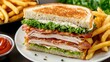 © Kenn W. - Delicious classic club sandwich with layers of turkey and bacon served with fresh lettuce, creamy mayonnaise, and crispy fries on a rustic plate