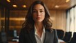 © Silard - Confident Woman in a Stylish Suit Standing in Front of a Boardroom, Exuding Strong Leadership Presence While Giving an Inspiring Speech