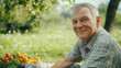 © romanets_v - Elderly caucasian male enjoying an outdoor picnic in a sunny garden