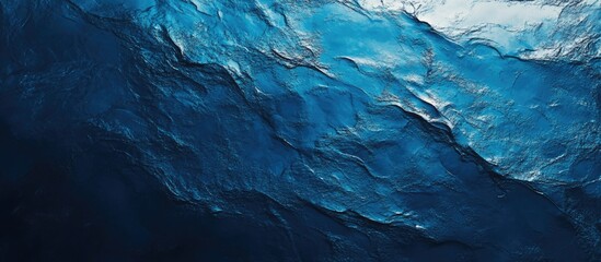 Fototapete - Dark blue abstract ocean texture with layered waves and a glossy finish, ideal for backgrounds, featuring deep blue tones and light reflections.