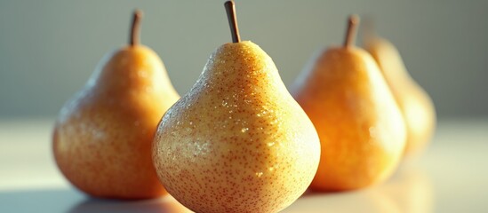 Fototapete - Golden ripe pears arranged with a prominent focus on the front pear against a soft blurred background, showcasing their smooth texture and warm hues.