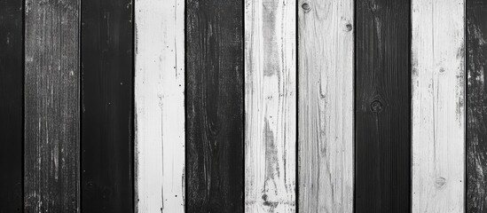 Leinwandbilder - Vertical wooden texture background featuring alternating black and white planks, showcasing natural grain patterns and spaced evenly for a balanced look.