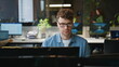 © stockbusters - Focused man looking desktop working at open space closeup. Smiling freelancer