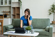 © NINENII - Happy woman working online from home, lifestyle and small business.