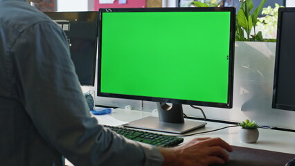 Wall Mural - Office guy using chromakey computer closeup. Worker hand holding mouse device