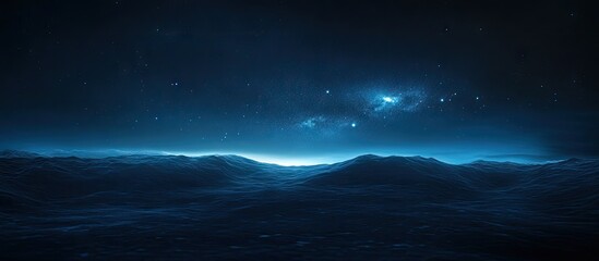 Wall Mural - Dark blue abstract ocean scene at twilight featuring gentle waves under a starry sky with bright light on the horizon suggesting a distant glow.