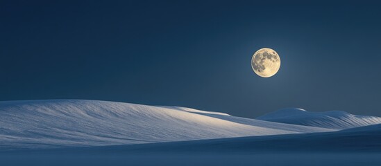Wall Mural - Moonlit landscape with bright full moon illuminating snow-covered hills in the foreground creating soft shadows and a serene night atmosphere