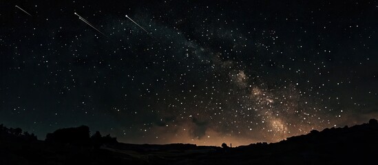 Wall Mural - Vast night sky with vibrant stars and Perseid meteors streaking across, illuminated by faint glow on horizon, creating a cosmic spectacle.