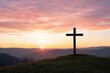 © Asayamrad - A silhouette of a cross against a vibrant sunset, casting a serene and reflective atmosphere over the landscape.