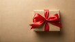 © VisualVault - A thoughtfully wrapped gift box featuring a vibrant red satin ribbon bow, presented on a neutral background