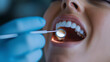 © Maksym - A close-up of a dentist's hands holding dental tools while preparing for a routine check-up in a bright clinic.