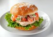 © ANUAR - Fresh and Delicious Chicken Sandwich with Crisp Vegetables and Creamy Sauce on a Soft Sesame Seed Bun Served on a White Plate