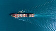 © boygek - Top view Cargo Container ship with contrail in the ocean ship carrying container and running for import export concept technology freight shipping by ship.