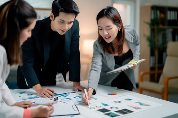 Poster - Professional team analyzing financial reports, collaborating closely in modern corporate workspace