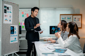 Poster - Business team analyzing financial charts and graphs, discussing company strategy and planning new projects during briefing