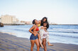 © Sabrina - Multiracial girls enjoy summer vacation together on the beach - Happy young women with different body and skin  having fun outdoor - Travel and holiday concept